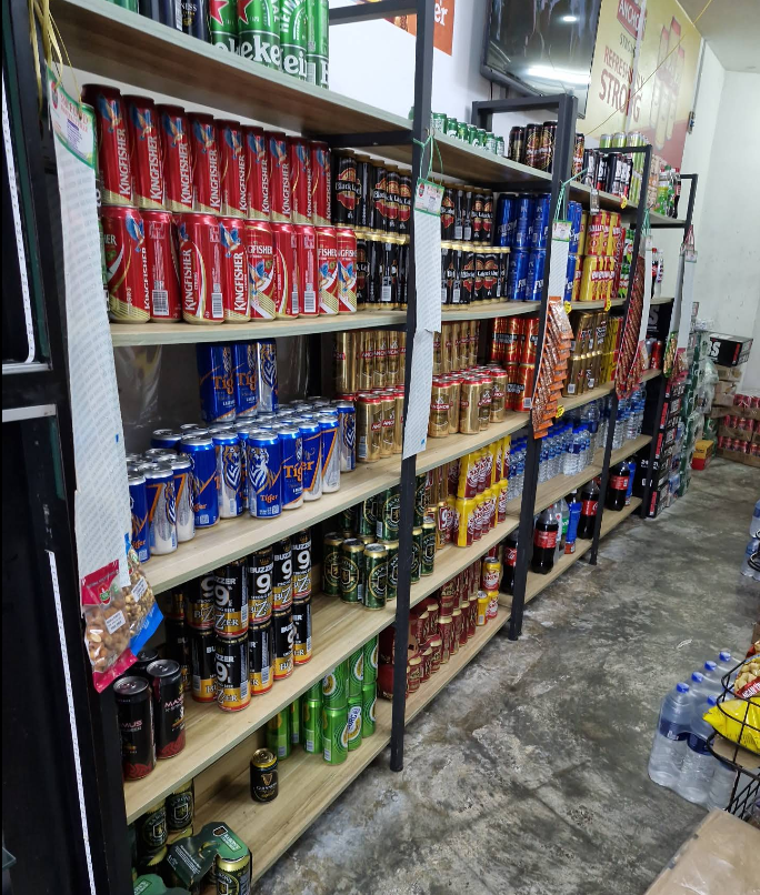 Stocked shelves with a wide range of beers and chilled drinks at Vetri Mart.